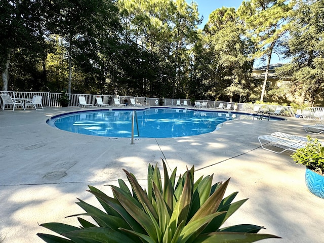 view of swimming pool featuring a patio area