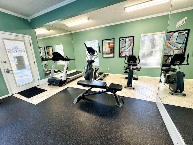 workout area with ornamental molding, a textured ceiling, and light tile patterned floors