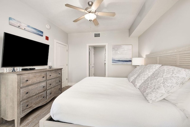 bedroom with hardwood / wood-style floors and ceiling fan