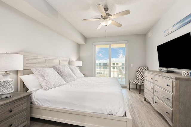 bedroom featuring light wood-type flooring, access to outside, and ceiling fan