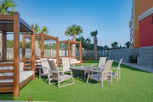 15928 Front Beach Rd Unit 3-409, Panama City Beach, FL 32413 - view of yard with a fenced backyard, a pergola, and a fire pit