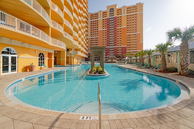 view of swimming pool with a patio