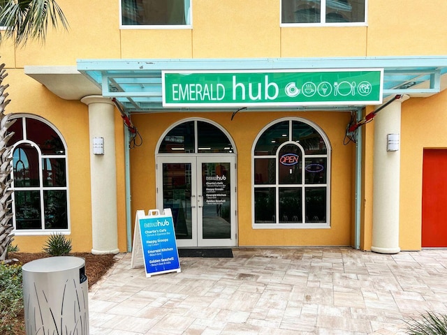 view of exterior entry featuring french doors