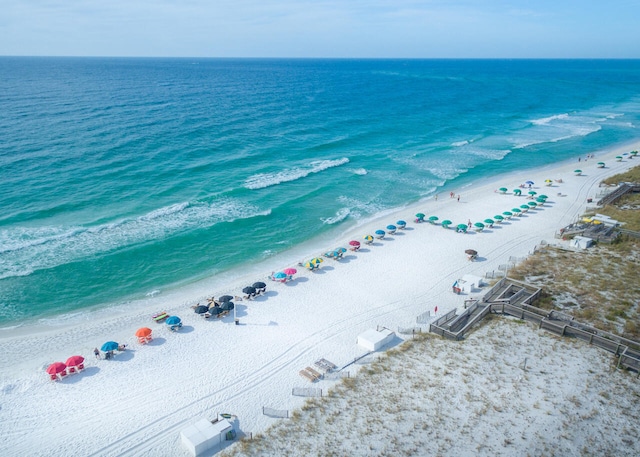 bird's eye view with a view of the beach and a water view