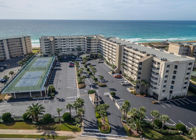 bird's eye view with a water view and a beach view