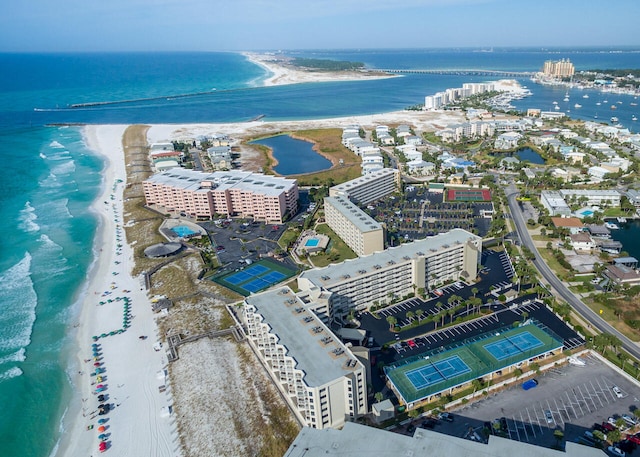 drone / aerial view featuring a water view and a beach view