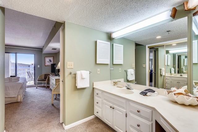 bathroom with vanity and a textured ceiling