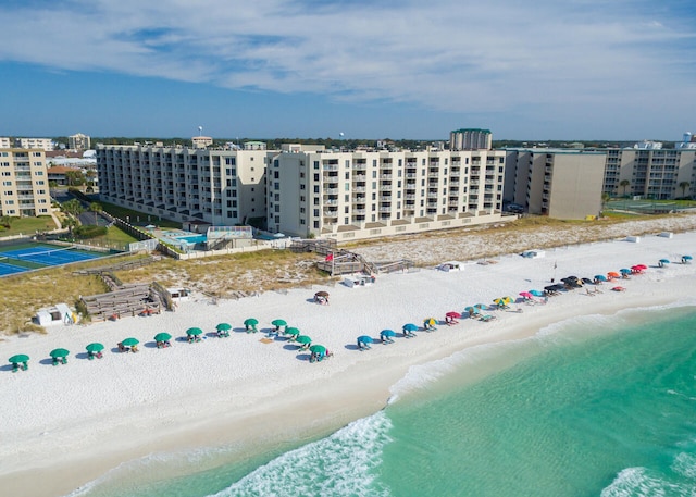 birds eye view of property featuring a view of the beach and a water view