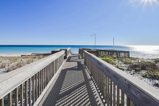 view of community featuring a water view and a view of the beach