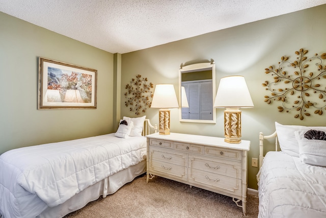 carpeted bedroom with a textured ceiling