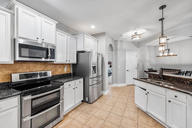 kitchen with sink, appliances with stainless steel finishes, and white cabinets