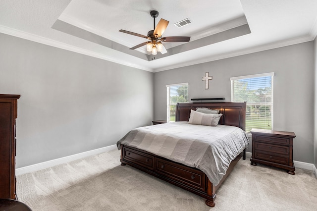 bedroom with crown molding, light carpet, multiple windows, and ceiling fan