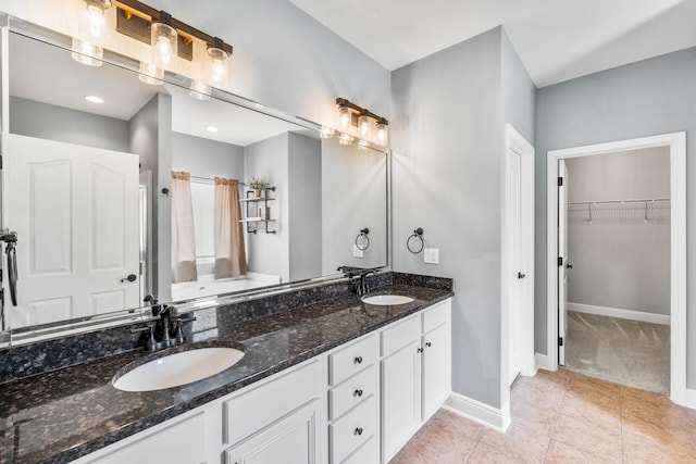 bathroom featuring vanity and tile patterned flooring