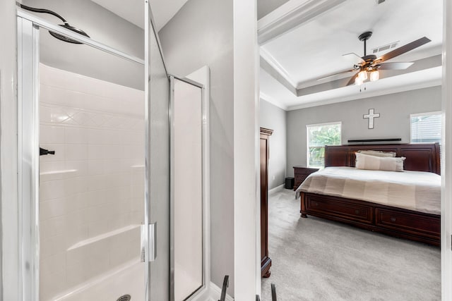 carpeted bedroom with crown molding and ceiling fan