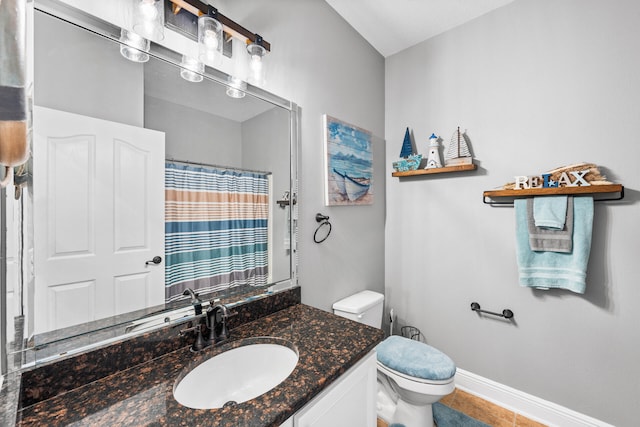 bathroom featuring vanity, toilet, and tile patterned floors