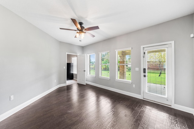 unfurnished room featuring ceiling fan and dark hardwood / wood-style flooring