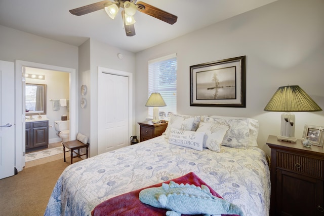 carpeted bedroom with a closet, ceiling fan, and connected bathroom