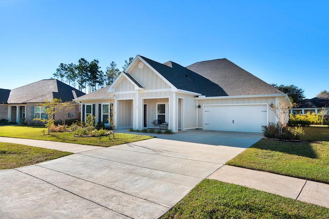 modern farmhouse featuring a porch, a garage, and a front lawn