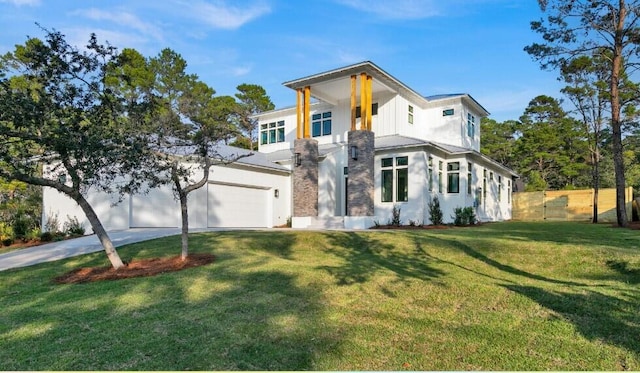 88 Beth Ln, Santa Rosa Beach, FL 32459 - contemporary home featuring a garage, concrete driveway, a front lawn, and fence