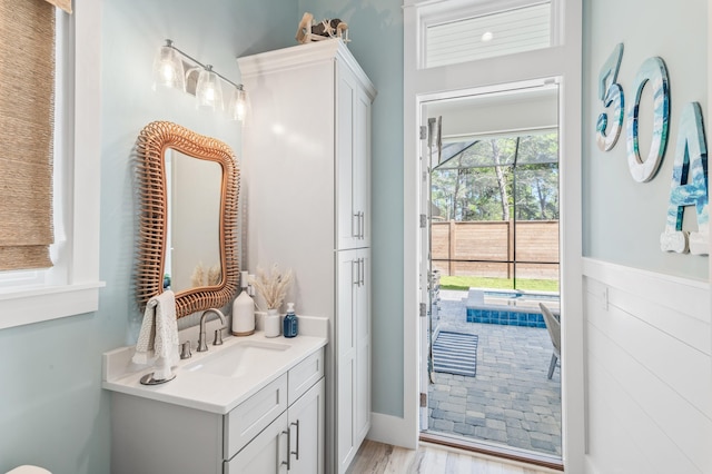 88 Beth Ln, Santa Rosa Beach, FL 32459 - bathroom with vanity and wood finished floors