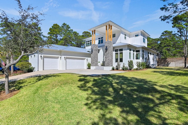 88 Beth Ln, Santa Rosa Beach, FL 32459 - contemporary house with a front lawn, driveway, fence, an attached garage, and metal roof