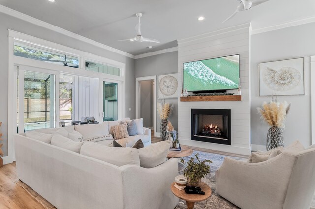 88 Beth Ln, Santa Rosa Beach, FL 32459 - living area with recessed lighting, ceiling fan, ornamental molding, light wood-style floors, and a large fireplace