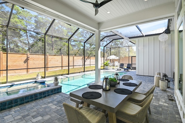 88 Beth Ln, Santa Rosa Beach, FL 32459 - view of swimming pool with glass enclosure, a fenced backyard, outdoor dining space, a ceiling fan, and a patio