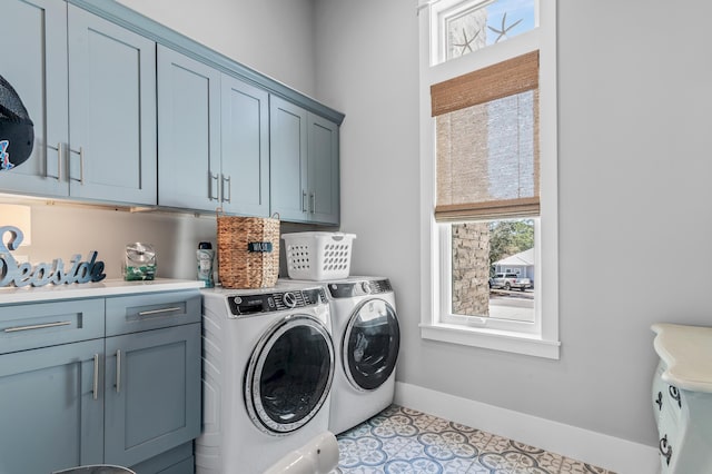 88 Beth Ln, Santa Rosa Beach, FL 32459 - washroom featuring washer and dryer, cabinet space, baseboards, and a wealth of natural light