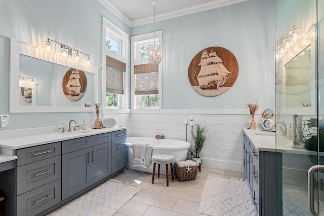 88 Beth Ln, Santa Rosa Beach, FL 32459 - bathroom with vanity, a freestanding bath, wainscoting, crown molding, and a notable chandelier