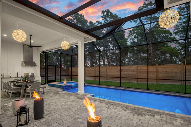 88 Beth Ln, Santa Rosa Beach, FL 32459 - view of pool with glass enclosure, a patio, a fire pit, and fence