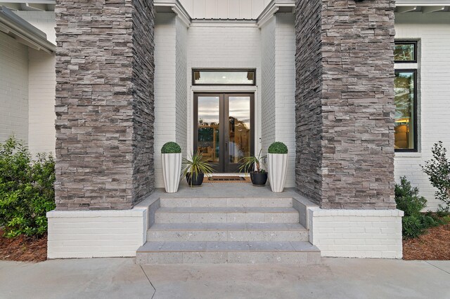 88 Beth Ln, Santa Rosa Beach, FL 32459 - property entrance featuring french doors and brick siding