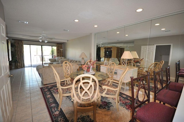 tiled dining room featuring ceiling fan