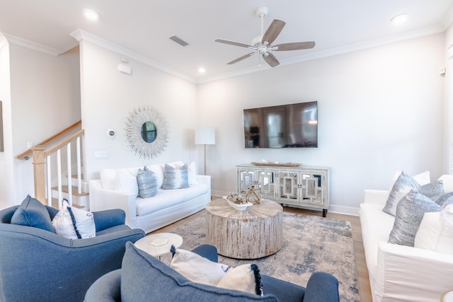 living room featuring ceiling fan, crown molding, and hardwood / wood-style floors