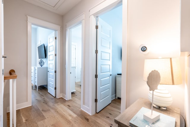 hallway with light wood-type flooring