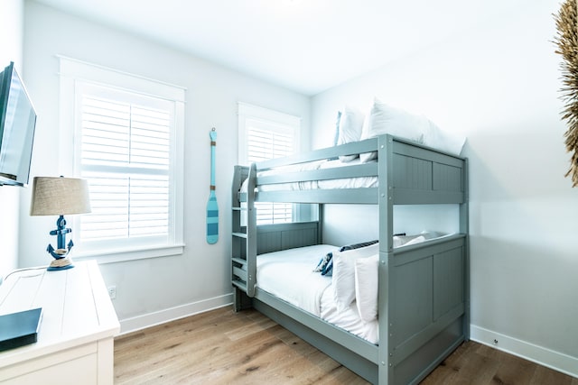 bedroom with hardwood / wood-style flooring