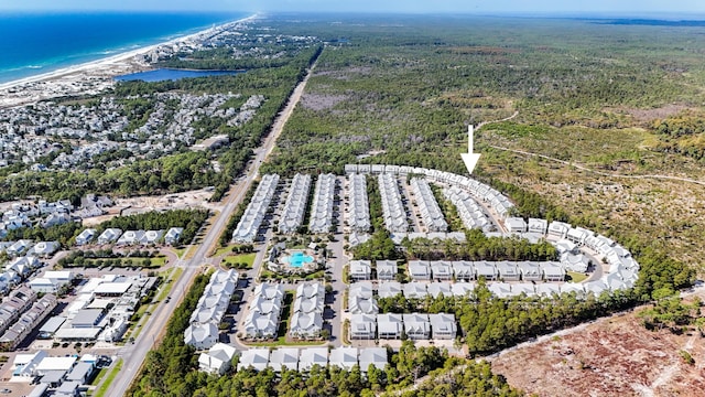 drone / aerial view with a water view and a view of the beach