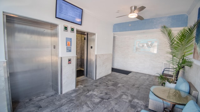 bathroom featuring elevator, tile walls, and ceiling fan