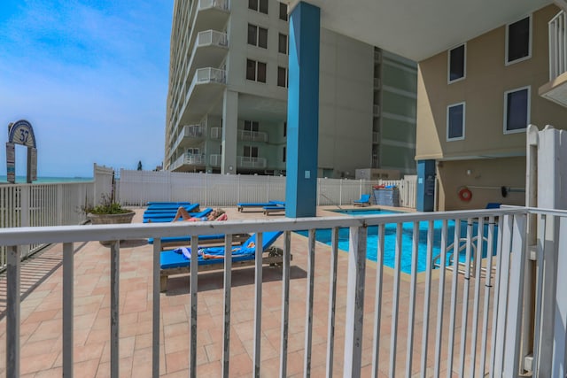 view of swimming pool featuring a patio