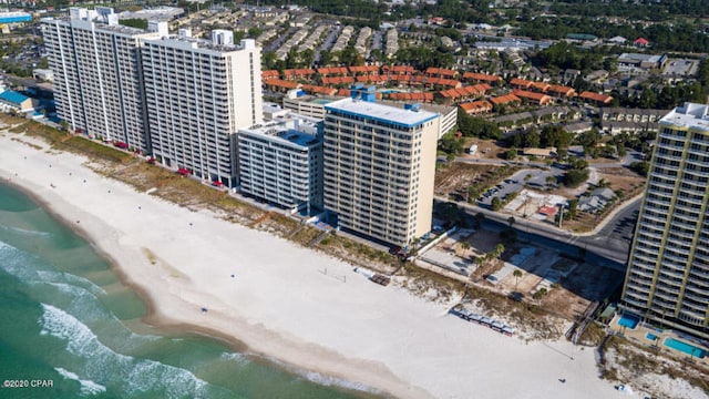 birds eye view of property featuring a view of the beach and a water view