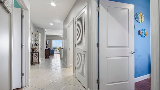 hallway with light tile patterned flooring