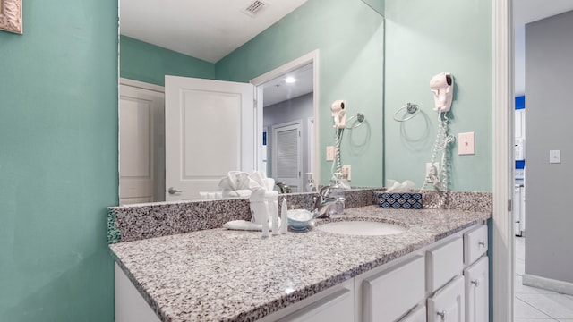 bathroom with vanity and tile patterned flooring