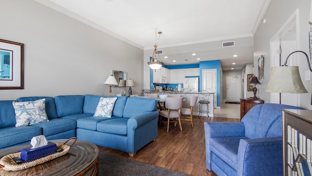 living room with crown molding and dark wood-type flooring