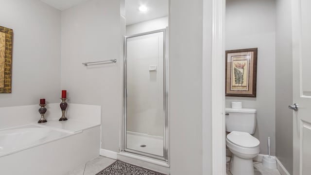 bathroom featuring toilet, tile patterned floors, and plus walk in shower