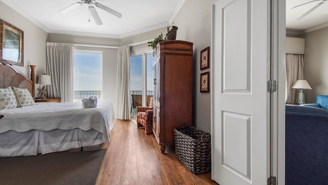 bedroom with ceiling fan, wood-type flooring, and ornamental molding