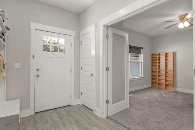 entrance foyer featuring light wood-type flooring and ceiling fan