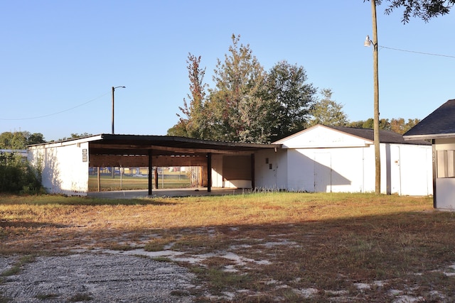 view of outbuilding with an outdoor structure and an attached carport