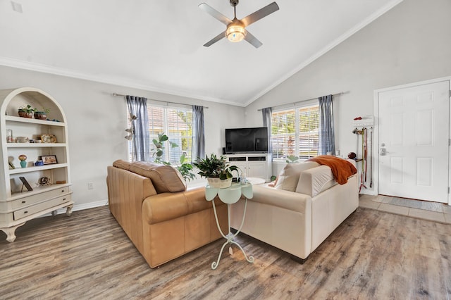 living room featuring a wealth of natural light, wood-type flooring, and ceiling fan