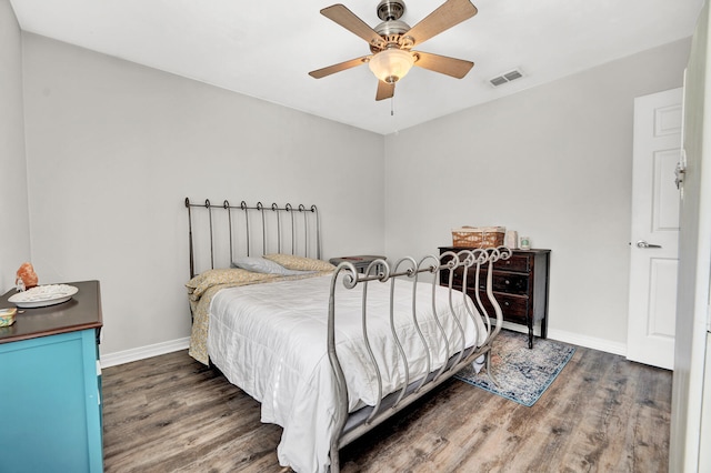 bedroom with dark wood-type flooring and ceiling fan