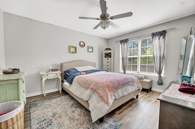 bedroom featuring wood-type flooring and ceiling fan