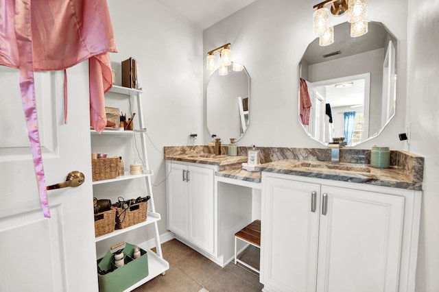 bathroom with vanity and tile patterned flooring